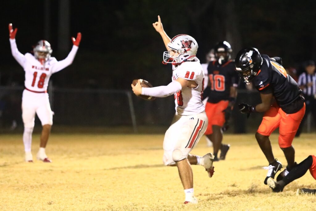 Williston's Ramey Webb (88) celebrates after scoring a touchdown with 12 seconds left in the game against Hawthorne in the Rural-Region 4 Final. Photo by C.J. Gish