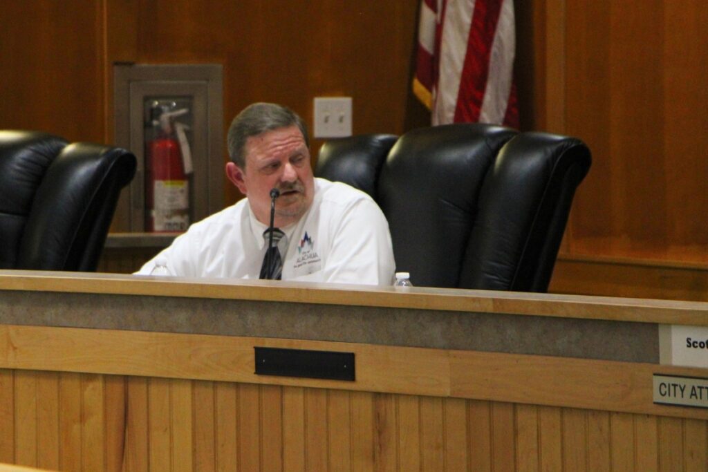 Bryan Thomas, director of Planning and Community Board, speaks at the November Planning and Zoning Committee meeting about the Tara April development.