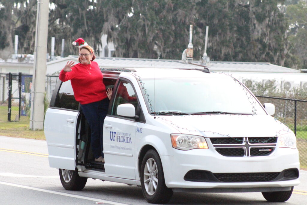 A UF employee waves to spectators on Tuesday morning. (Photo by Nick Anschultz)