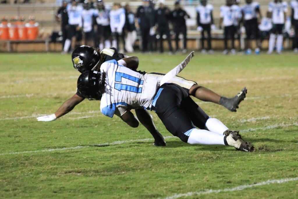 A West Broward defender tackles a Buchholz runner for a fourth-down stop on the goal line.