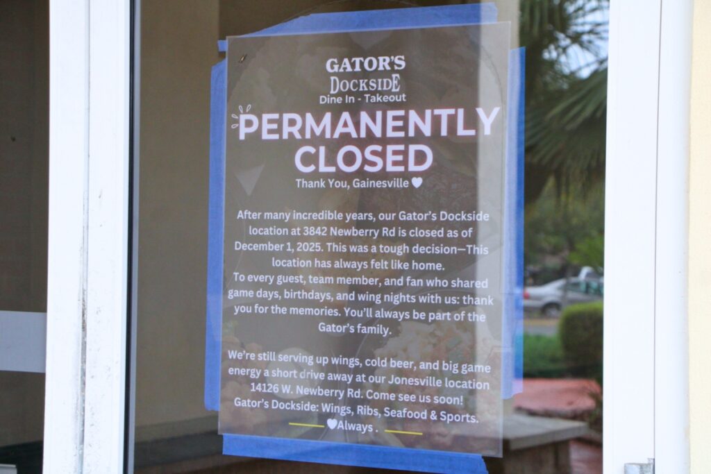 A sign was posted in Gator's Dockside location off Newberry Road in Gainesville saying that it was permanently closing on Monday. Photo by Lillian Hamman