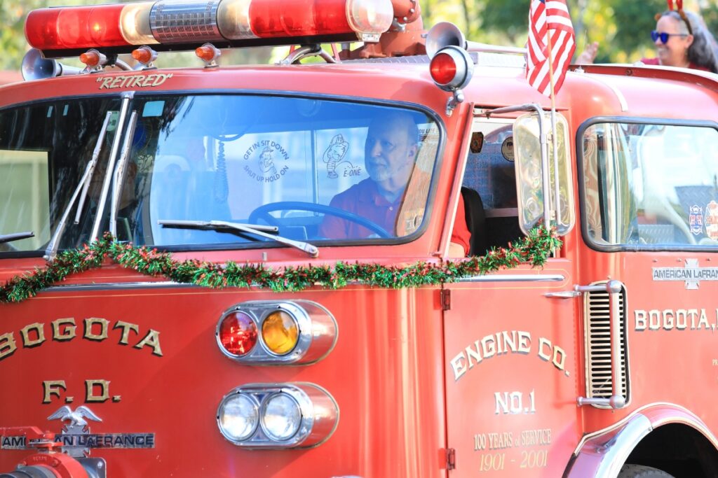 A vintage fire engine rumbles through A Very GNV Holiday Parade. Photo by Seth Johnson