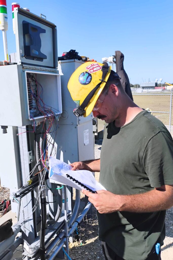 An apprentice in the Electrical Training Alliance of Gainesville program participating in on-the-job training. Courtesy of Trevor Chapman