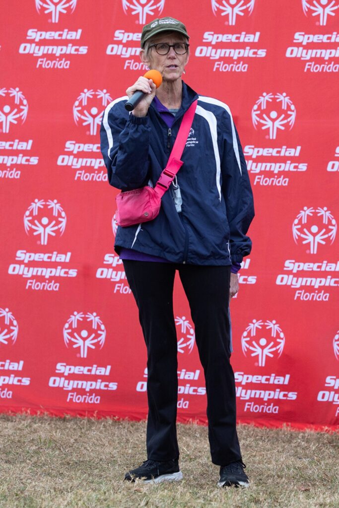 Berit Amlie, chief administrative officer and general counsel for Special Olympics Florida, greets event attendees.