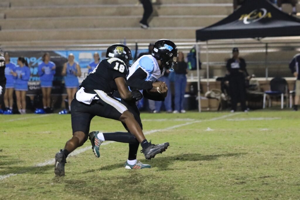 Bobcat Amaris Bryant wraps up the West Broward quarterback.