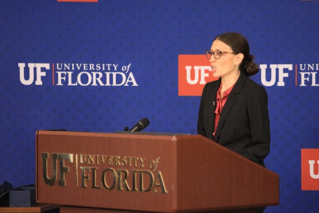Brandi Renton, vice president for business affairs, speaks from behind a podium.