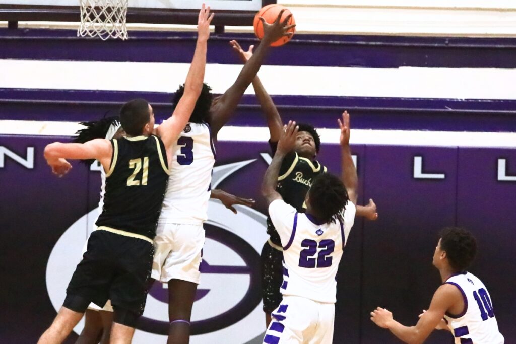 Buchholz and Gainesville players fight for a rebound. Photo by C.J. Gish