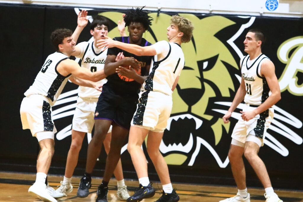 Buchholz defenders swarm Columbia's Terrance Tolbert (20). Photo by C.J. Gish