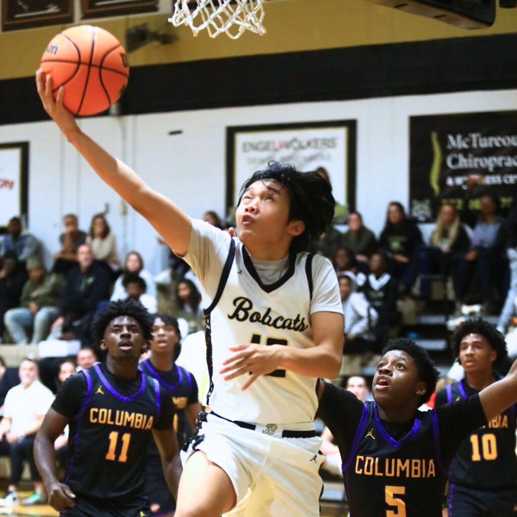Buchholz's Ezra Olmedo (12) puts up a shot against Columbia. Photo by C.J. Gish