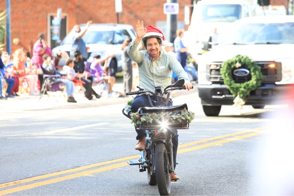 Commissioner Bryan Eastman rides and waves during the parade. Photo by Seth Johnson