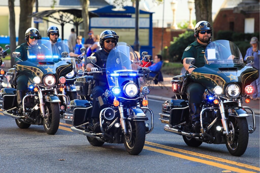 Deputies with the Alachua County Sheriff's Office and officers with Gainesville Police Department ride through downtown for A Very GNV Holiday Parade. Photo by Seth Johnson