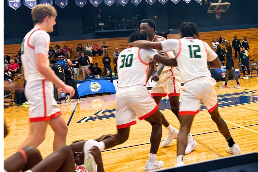 Eastside celebrates after Brendan Brockington hit a game-winning 3-pointer at the buzzer to beat Rickards (Tallahassee) , 38-37, on Monday at the Florida Get Down Showcase. Photo by Marty Pallman