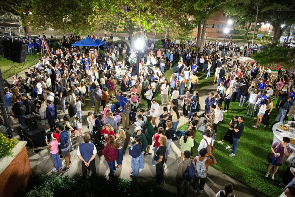 Event attendees mill about the Auditorium Lawn between music performances. Photo by Megan V. Winslow