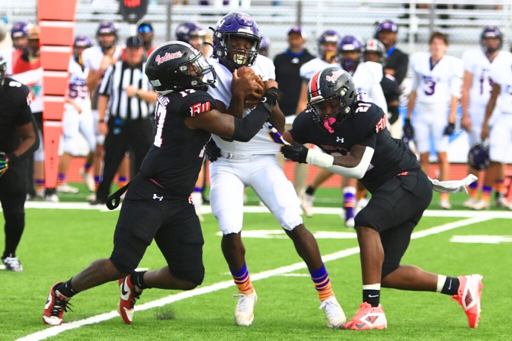 Fort White's Cameron Lumpkin (17) and Carson Lumpkin (21) with a first-quarter sack against Port St. Joe in the Rural Florida Invitation Tournament Championship game. Photo by C.J. Gish