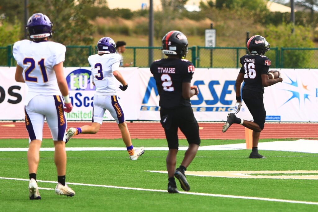 Fort White's Desean Lally (16) scores his second first-quarter touchdown against Port St. Joe in the Rural Florida Invitation Tournament Championship game. Photo by C.J. Gish 1 (1)