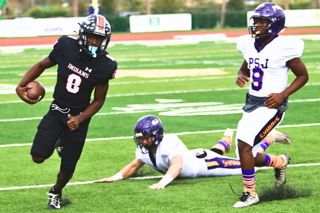 Fort White's Jayden Jackson (8) on a first-quarter quarterback run against Port St. Joe in the Rural Florida Invitation Tournament Championship game. Photo by C.J. Gish