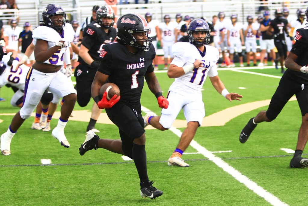 Fort White's John Lawson (1) with a first-quarter run for a first down against Port St. Joe in the Rural Florida Invitation Tournament Championship game. Photo by C.J. Gish