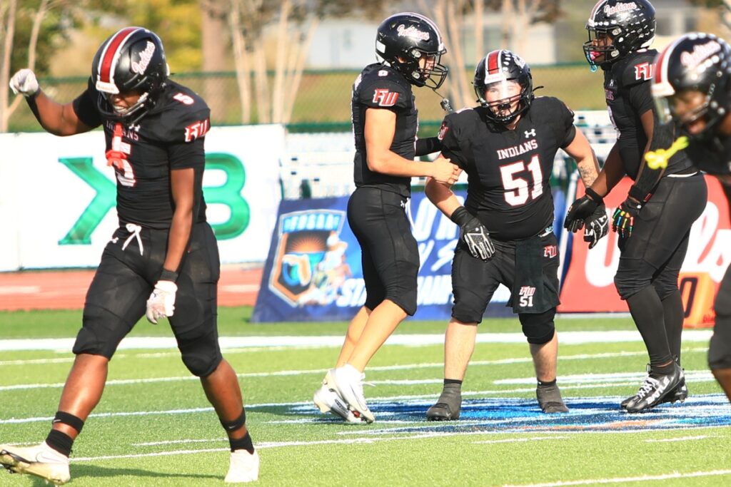 Fort White's defense celebrates after Ethan Shaw recovered a third-quarter fumble against Port St. Joe in the Rural Florida Invitation Tournament Championship game. Photo by C.J. Gish 1 (1)