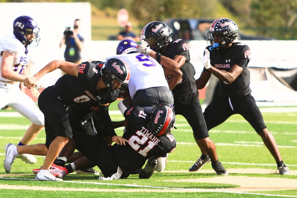 Fort White's defense swarms for a third-quarter against Port St. Joe in the Rural Florida Invitation Tournament Championship game. Photo by C.J. Gish