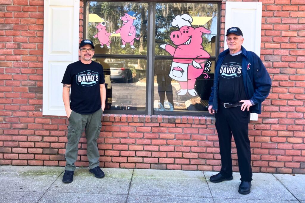 From left, David's BBQ new owner Ken Townsley and former owner of 36 years Brian Hood stand outside the restaurant.