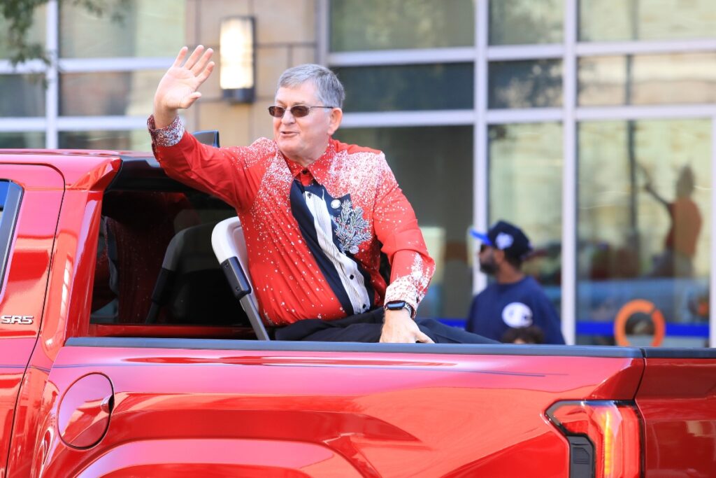 Gainesville Commissioner Ed Book greets parade attendees. Photo by Seth Johnson