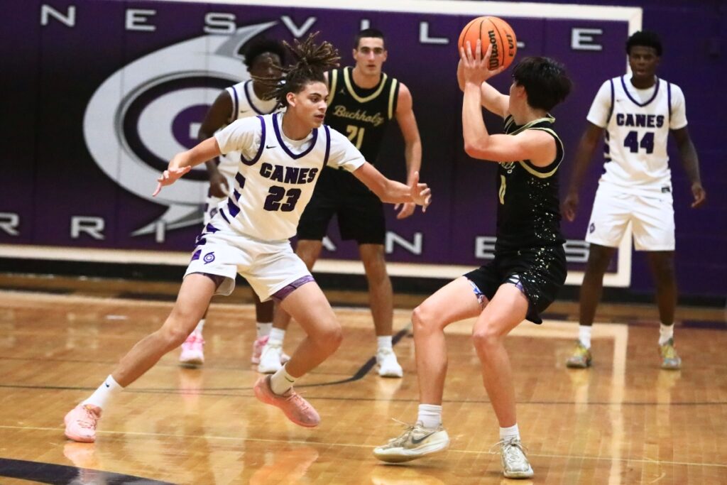 Gainesville's Aiden Raney (23) defends Buchholz's Jacob Bromirski (0). Photo by C.J. Gish