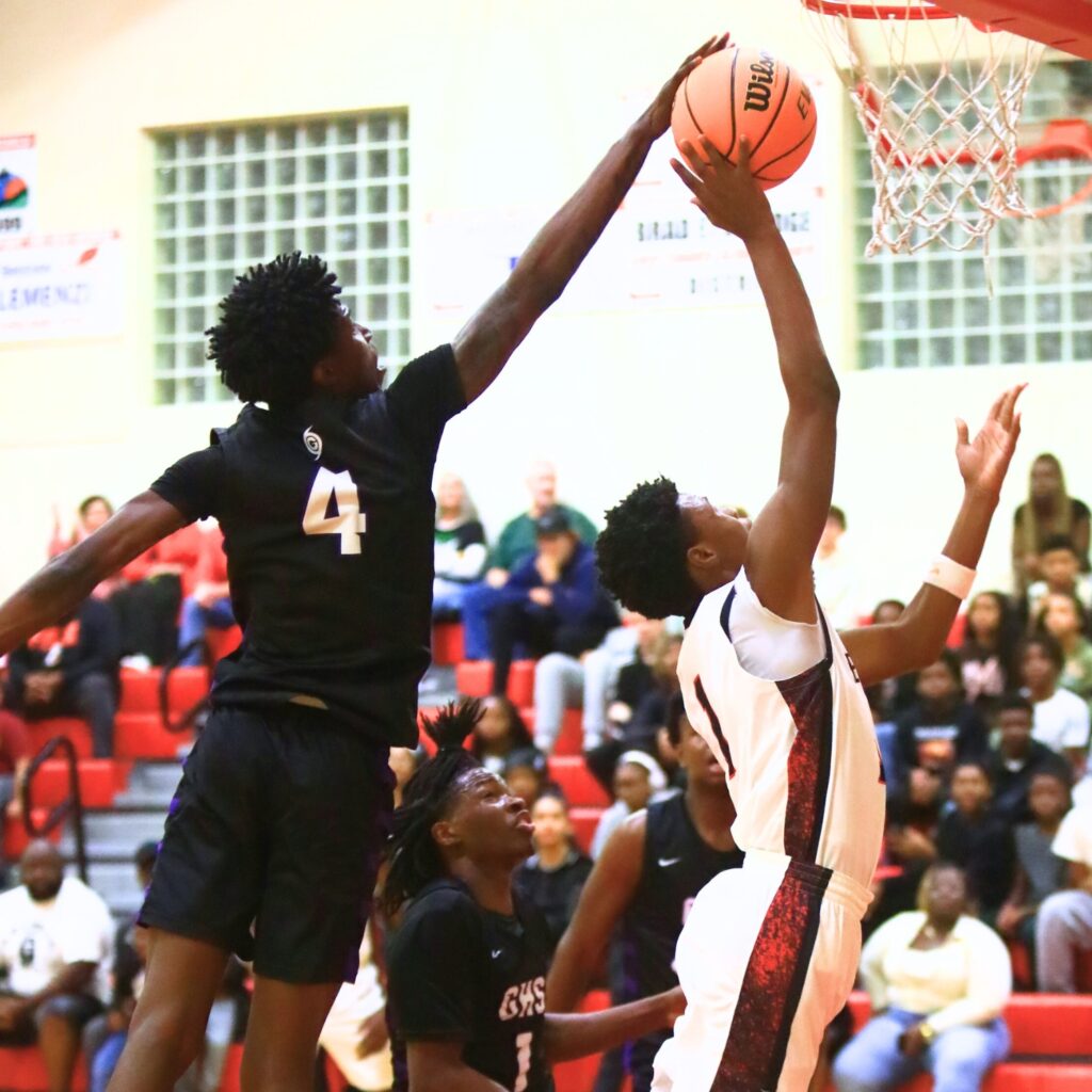 Gainesville's Craig Thomas Jr. (4) blocks a shot by Williston's Marcus Appling (1). Photo by C.J. Gish