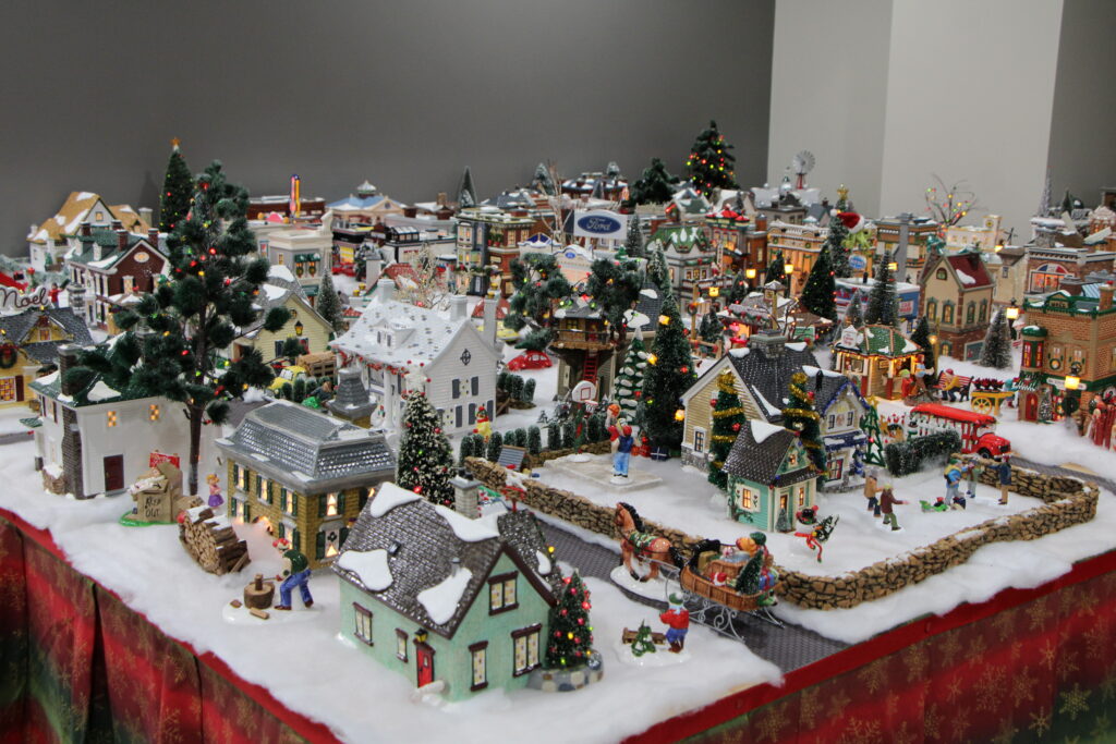 Gala Bank's CEO Carl Walls displays his Christmas village in the new Gainesville branch. 