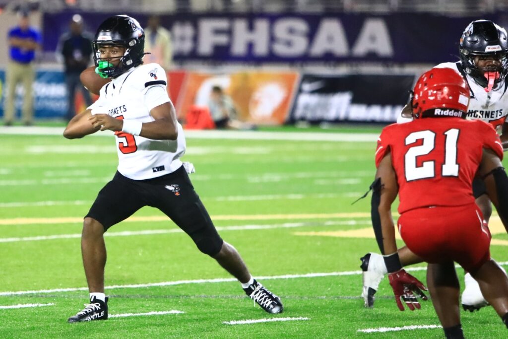 Hawthorne quarterback Richard Roundtree Jr. (5) with a first-half pass against Blountstown in the FHSAA Rural State Championship game. Photo by C.J. Gish