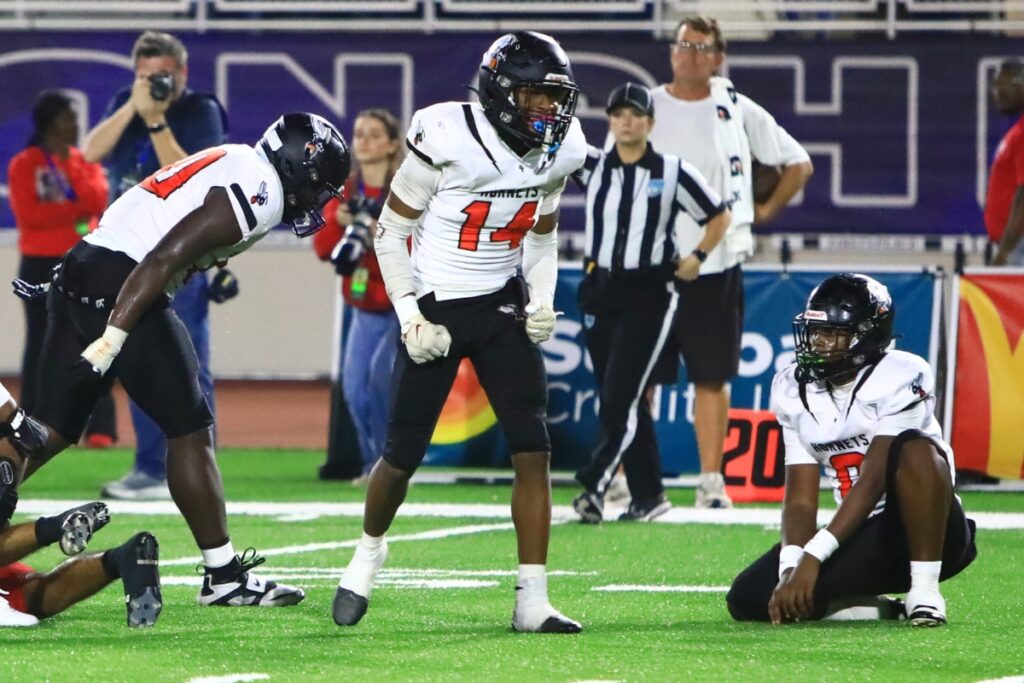 Hawthorne's Ced Hicks (14) celebrates a Hornets' first-half defense stop against Blountstown in the FHSAA Rural State Championship game. Photo by C.J. Gish