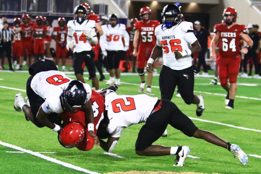 Hawthorne's Messiah Gent (8) and Nathan Jennings (2) with a tackle against Blountstown in the FHSAA Rural State Championship game. Photo by C.J. Gish