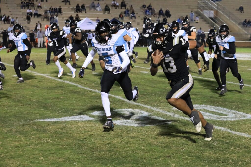 Justin Williams runs down the sideline for a Buchholz first down.