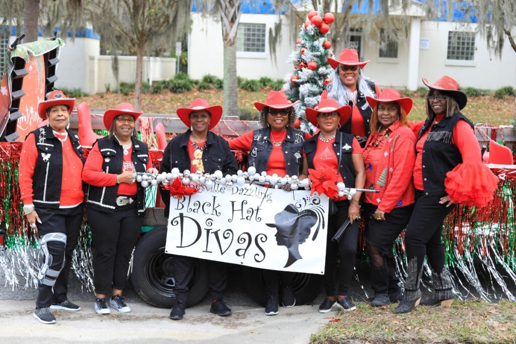 Members of Gainesville Dazzling Black Hat Divas ready to enter the parade. Photo by Seth Johnson
