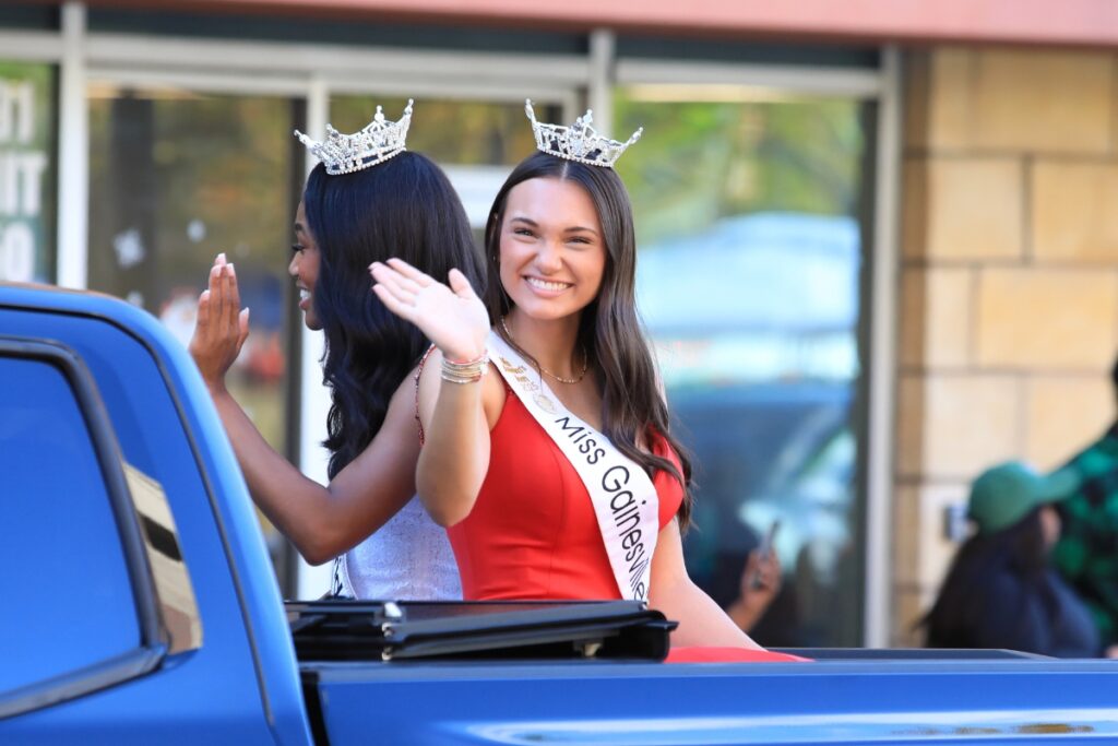 Miss Gainesville's Teen 2025 Ashlee Combee waves during A Very GNV Holiday Parade. Photo by Seth Johnson