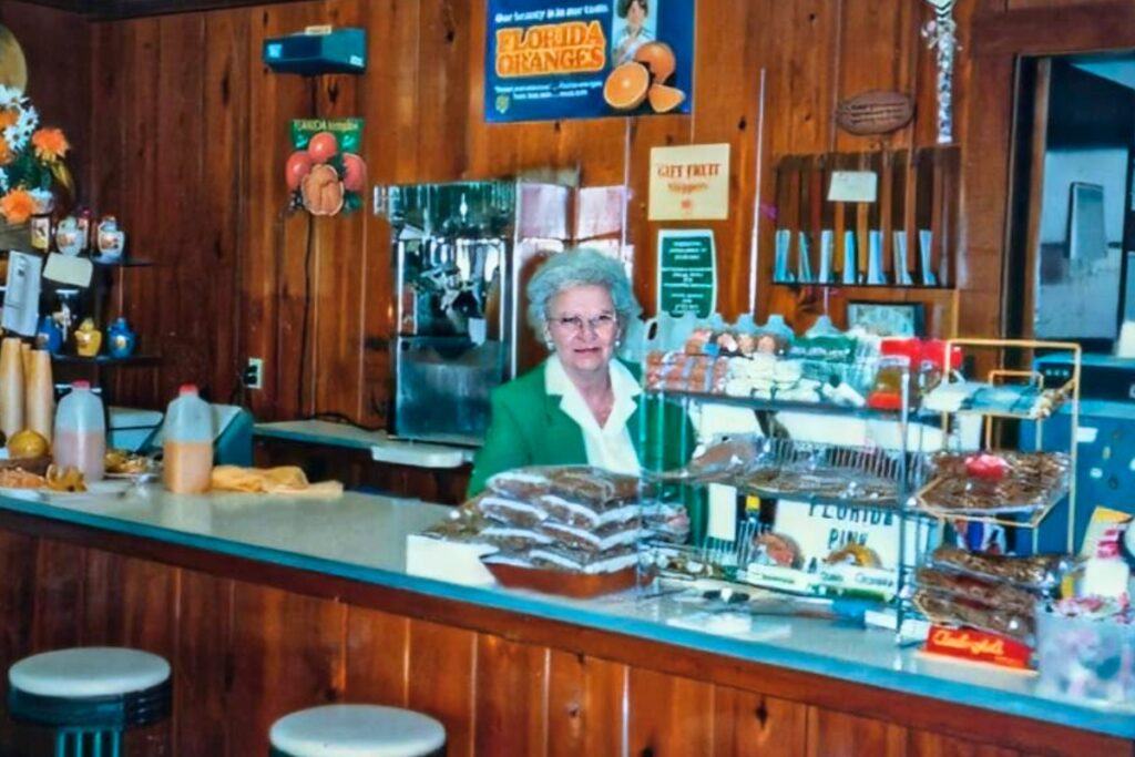 Ollie Huff worked behind the counter at the Huff's citrus shop serving up hand-squeezed glasses of orange juice to travelers on 441. Courtesy of Alachua Conservation Trust