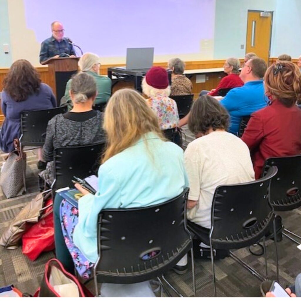 Outgoing Bacopa Editor-in-Chief J.N. Fishhawk addresses the audience. Photo by Jenny Dearinger