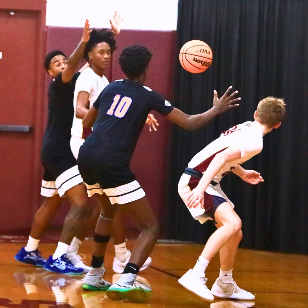 P.K. Yonge's Eugene Hall (10) steals a pass against Oak Hall. Photo by C.J. Gish