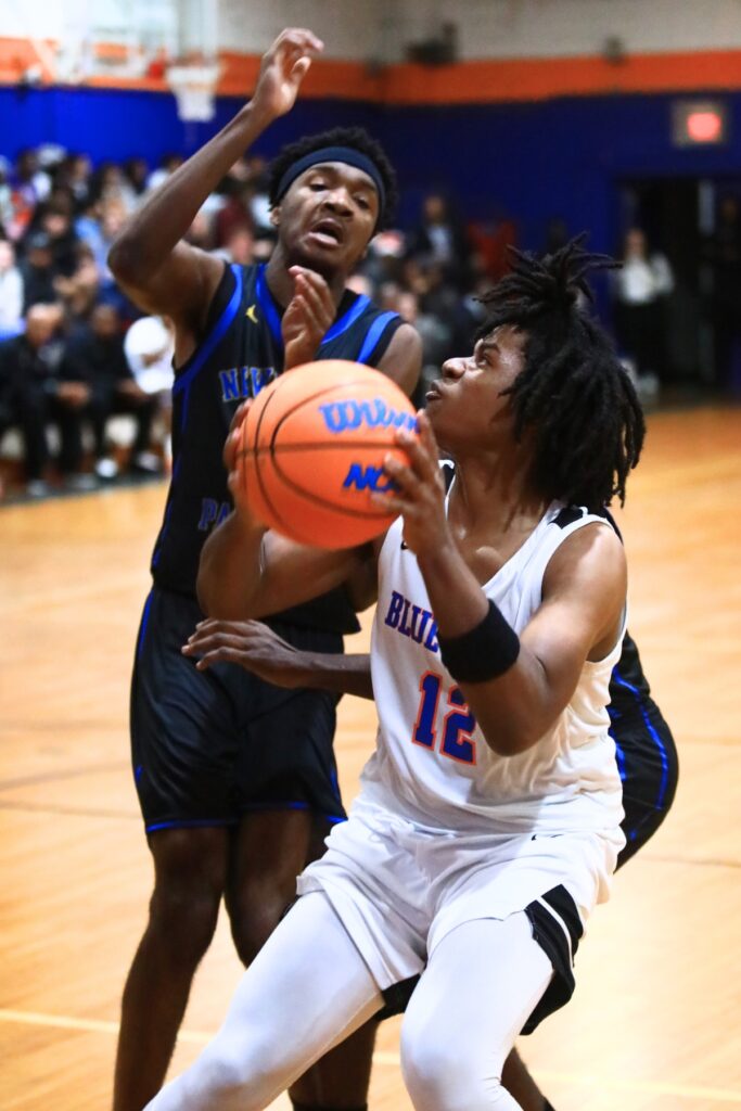 P.K. Yonge's Jarvis Cook Jr. (12) goes up for a shot against Newberry. Photo by C.J. Gish