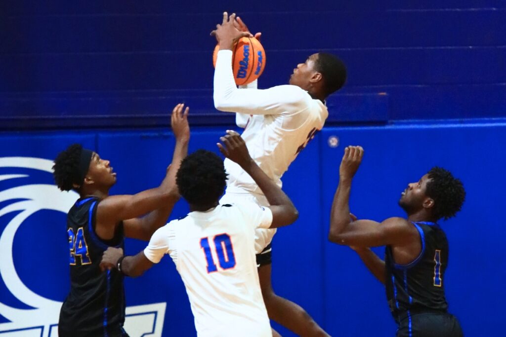 P.K. Yonge's Tray’Sean Jones (15) grabs an offensive rebound against Newberry. Photo by C.J. Gish