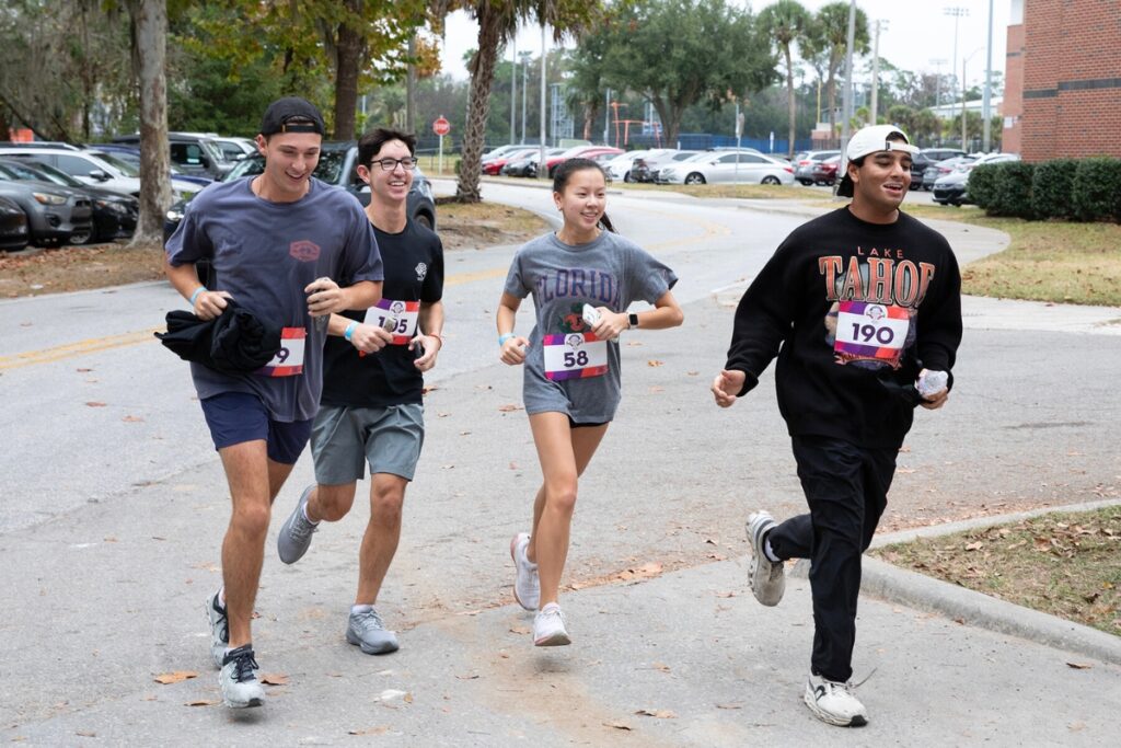 Participants jog down Woodlawn Drive and onto Flavet Field, where the race started and ended.
