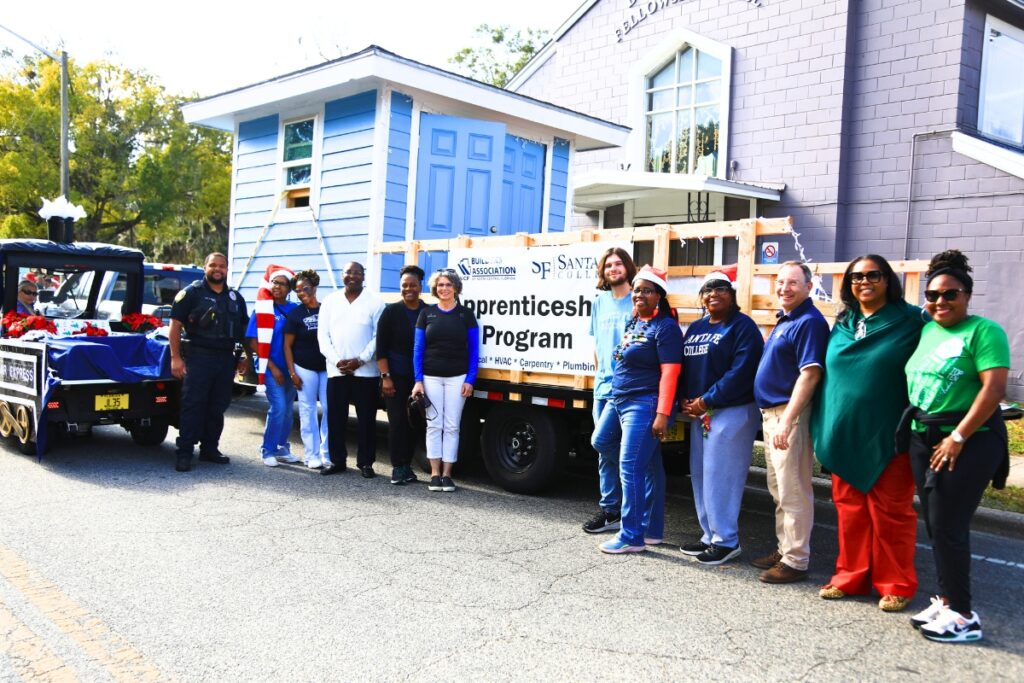 Representatives of Santa Fe College and the Builders of North Central Florida's apprentice program at the 2025 A Very GNV Holiday Parade. Photo by C.J. Gish
