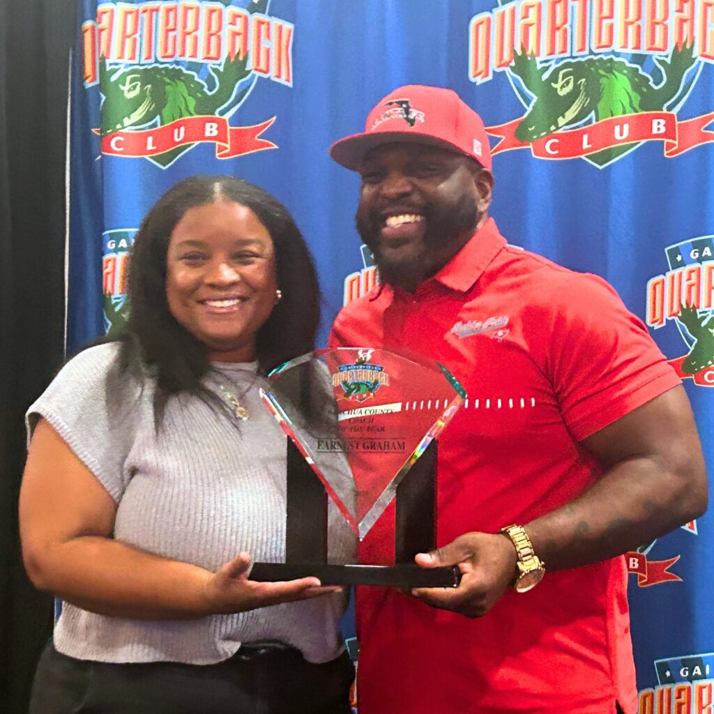 Santa Fe's Earnest Graham (right), with his wife, Alicia, was awarded the 2025 Coach of the Year by the Gainesville Quarterback Club. Photo by Marty Pallman