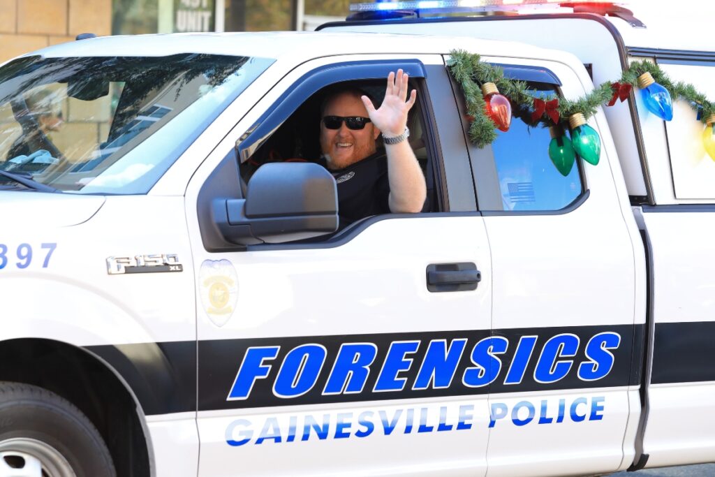 The Gainesville Police Department Forensics Unit passes by in the parade. Photo by Seth Johnson