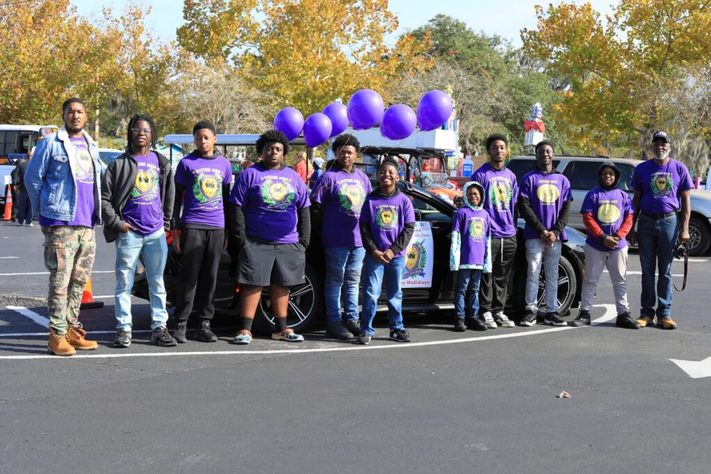 The Manhood Foundation Inc. prepares to ride and walk through the parade. Photo by Seth Johnson