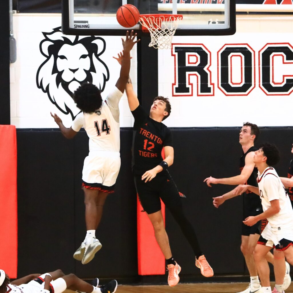 The Rock's Deondre Alford (14) puts up a shot against Trenton's Hunter Hilliard (12). Photo by C.J. Gish 1