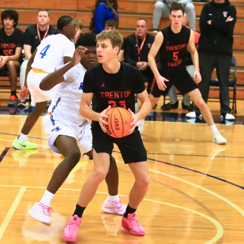 Trenton's Marc Micale (23) looks to pass against Rickards (Tallahassee). Photo by C.J. Gish