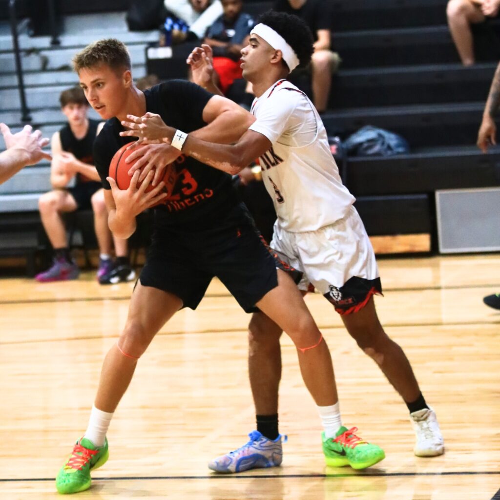 Trenton's Marc Micale (23) snags the ball away from The Rock's Kayden Merricks (3). Photo by C.J. Gish 1