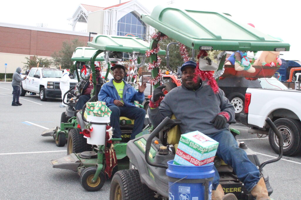 UF Facilities Services employees pose for a photo prior to the start of the Children's Christmas Parade (Photo by Nick Anschultz)