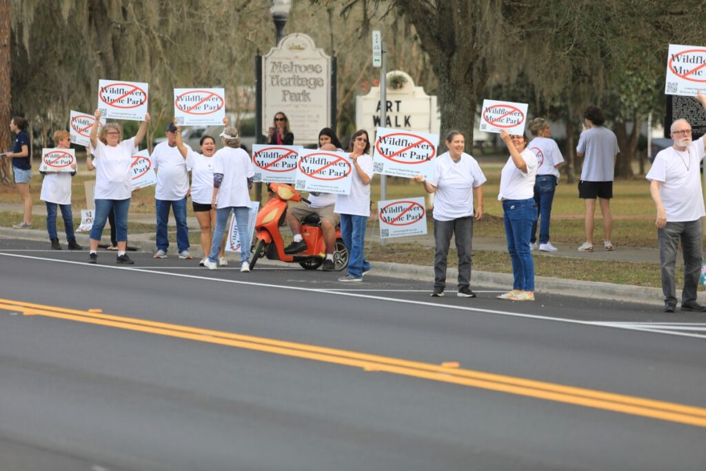 A protest in Melrose gathers along SR 26.