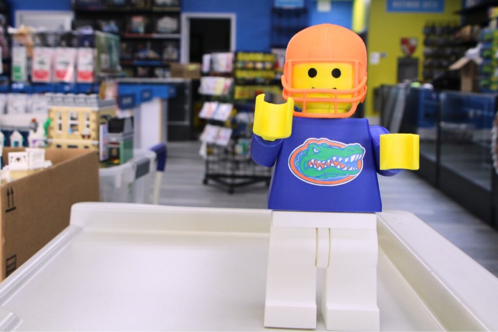 A 3D printed LEGO Tim Tebow decorates Gainesville's Bricks & Minifigs store. Photo by Lillian Hamman